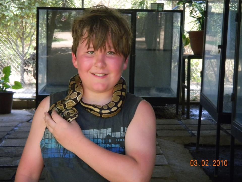 Hunter with snake around his neck 2010